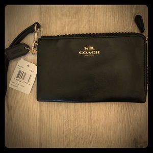 Coach flat emblem wristlet. Black/gold